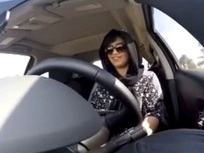 FILE - This Nov. 30, 2014 image made from video released by Loujain al-Hathloul, shows her driving towards the United Arab Emirates - Saudi Arabia border before her arrest on Dec. 1, 2014, in Saudi Arabia. The arrest of 10 women's rights advocates, including  Al-Hathloul, just weeks before the kingdom is set to lift the world's only ban on women driving, on June 24, is seen as the culmination of a steady crackdown on anyone perceived as a potential critic of the government. Al-Hathloul in her late 20s is among the most outspoken women's rights activists in the kingdom.
