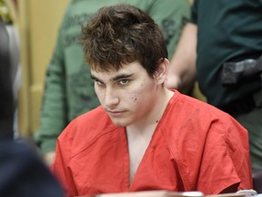 In this April 27, 2018 file photo, Florida school shooting suspect Nikolas Cruz looks up while in court for a hearing in Fort Lauderdale, Fla.