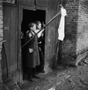 German children displaying surrender flag in Sogel, Germany, on April 10, 1945.