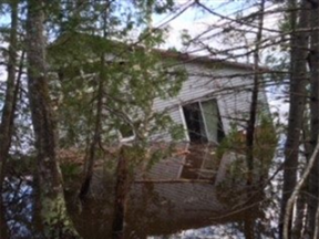Delberta Flood found an entire home sitting by the shore near her home.
