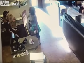 Screen shot of a video posted to Liveleak of an irate woman at a Tim Hortons in Langley.