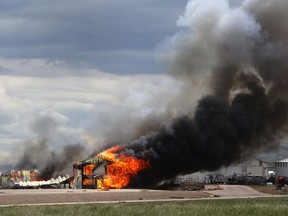 The Ultramax Ammunition company is engulfed in flames Tuesday, May 8, 2018, north of Interstate 90 and just east of Rapid City, S.D. Fire crews were worried about exploding ammunition and evacuated the area around the blaze.