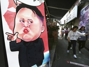 A banner showing a caricature of North Korean leader Kim Jong Un is displayed in Seoul, South Korea, Thursday, May 31, 2018. A senior North Korean official and the top U.S. diplomat had dinner in New York on Wednesday as President Donald Trump and Kim Jong Un try to salvage prospects for a high-stakes nuclear summit. It's the highest-level official North Korean visit to the United States in 18 years.