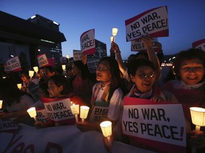 Women protesters stage a rally for peace on the Korea peninsular near U.S. Embassy in Seoul, Wednesday, May 23, 2018. U.S. President Donald Trump labored with South Korea's Moon Jae-in Tuesday to keep the highly anticipated U.S. summit with North Korea on track after Trump abruptly cast doubt that the June 12 meeting would come off. Setting the stakes sky high, Moon said, "The fate and the future of the Korean Peninsula hinge" on the meeting.
