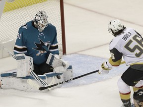 San Jose Sharks goalie Martin Jones (31) defends against a shot by Vegas Golden Knights left wing Erik Haula (56), from Finland, during the third period of Game 4 of an NHL hockey second-round playoff series in San Jose, Calif., Wednesday, May 2, 2018. The Sharks won 4-0.