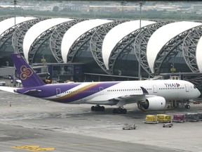 A Thai Airways jet parking at Suvarnabhumi Airport Bangkok, Thailand, Friday, May 11, 2018. The International Federation of Air Line Pilots' Association has warned that soft ground conditions at Bangkok's main international airport can cause the pavement of its taxiways to buckle or otherwise fail.