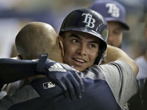 Tampa Bay Rays' Willy Adames celebrates in the dugout after hitting a home run off Boston Red Sox starting pitcher Chris Sale during the fourth inning of a baseball game Tuesday, May 22, 2018, in St. Petersburg, Fla.