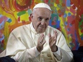 Pope Francis gestures during a visit to the "Scholas Occurentes" Foundation in Rome, Italy, May 11, 2018.