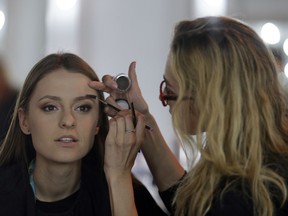 Ieva Zasimauskaite from Lithuania has her hair and make-up done backstage in Lisbon, Portugal, Saturday, May 12, 2018 before the Eurovision Song Contest grand final.