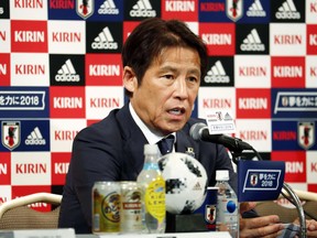 Japan Football Association (JFA) new head coach Akira Nishino attends a press conference in Tokyo Friday, May 18, 2018. Keisuke Honda and Shinji Kagawa were named on Friday to Japan's squad for an international friendly on May 30 against Ghana in Yokohama.