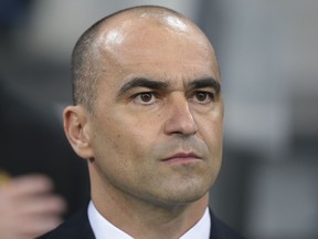 FILE - In this March 28, 2017 file photo, Belgium coach Roberto Martinez watches the international friendly soccer match between Russia and Belgium at Fisht stadium in Sochi, Russia.  Belgium has extended the contract of coach Martinez for two years ahead of the World Cup, rewarding the Spaniard for a steady course and encouraging results. The Belgian federation said in a statement Friday, May 18, 2018,  that it "has been delighted with this positive, professional and sincere collaboration with Roberto Martinez" and lauded "Belgium's impeccable performance during the World Cup qualification."