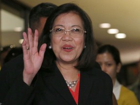 FILE - In this March 9, 2018 file photo, Philippine Supreme Court Chief Justice Maria Lourdes Sereno waves as she arrives for a forum with foreign correspondents based in the country in suburban Quezon city northeast of Manila, Philippines.  The embattled Philippine chief justice has returned to office after taking leave two months ago amid efforts by President Rodrigo Duterte's administration to oust her from the Supreme Court. Chief Justice Maria Lourdes Sereno's spokesman Jojo Lacanilao told The Associated Press that she resumed work Wednesday, May 9, 2018,  at the Supreme Court, defying calls from Duterte's allies for her to step down.