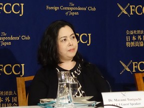 Mayumi Taniguchi, an Osaka International University professor on gender and human rights issues, talks about the results of her recent survey on sexual harassment among women working in the Japanese media during her speech at the Foreign Correspondents Club of Japan in Tokyo, Monday, May 21, 2018. A survey of women working for Japanese newspapers and TV networks has found 156 cases of alleged sexual misconduct reported by 35 women, about one-third of which involved lawmakers, government officials and law enforcers. Taniguchi, a gender studies expert, said Monday the survey was prompted by a recent widely publicized case of alleged sexual mistreatment of a journalist by a senior finance ministry official.