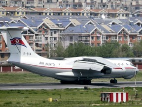 A North Korea's Air Koryo plane lands in an airport in Dalian, China, Tuesday, May 8, 2018. Japanese and South Korean media are speculating that a high-ranking North Korean official is visiting China after the airliner from the North landed in the Chinese port city of Dalian.