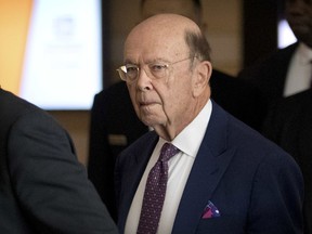 FILE - In this May 4, 2018, file photo, U.S. Commerce Secretary Wilbur Ross leaves his hotel in Beijing. An American business group appealed to China to allow more access to its state-dominated economy ahead of a visit by Ross for trade talks. He said the tariffs — 25 per cent on imported steel, 10 per cent on aluminum — would take effect Friday.