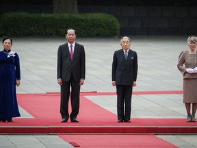 Vietnamese President Tran Dai Quang, second from left, and his wife Nguyen Thi Hien, left, stand with Japan's Emperor Akihito and Empress Michiko during a welcome ceremony at the Imperial Palace in Tokyo Wednesday, May 30 2018. The Vietnamese president and his wife Nguyen Thi Hien are on a five-day visit to Japan.