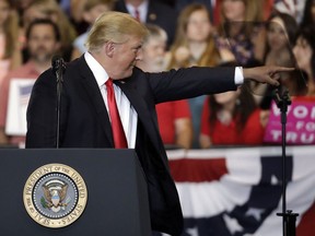 President Donald Trump points to an audience member as he speaks at a rally at the Nashville Municipal Auditorium Tuesday, May 29, 2018, in Nashville, Tenn.