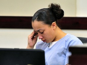 FILE - In this Nov. 13, 2012, file photo, Cyntoia Brown reacts during her hearing in Nashville, Tenn. Brown, who is serving a life sentence for killing a man when she was a 16-year-old prostitute, is going to make her case for clemency at a hearing in a Tennessee prison. The state's Board of Parole will make a recommendation sometime after the hearing Wednesday, May 23, 2018. But the decision will ultimately be up to Gov. Bill Haslam.