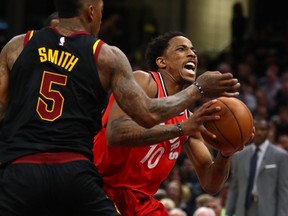 Toronto Raptors guard DeMar DeRozan tries to drive past Cleveland Cavaliers guard JR Smith on May 5.