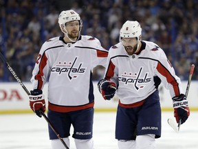 Washington Capitals defenseman Michal Kempny (6) celebrates with center Evgeny Kuznetsov (92) after Kempny scored against the Tampa Bay Lightning during the first period of Game 1 of an NHL Eastern Conference final hockey playoff series Friday, May 11, 2018, in Tampa, Fla.