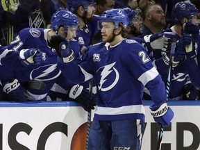 Tampa Bay Lightning center Brayden Point (21) celebrates with the bench after scoring against the Washington Capitals during the first period of Game 2 of the NHL Eastern Conference finals hockey playoff series Sunday, May 13, 2018, in Tampa, Fla.