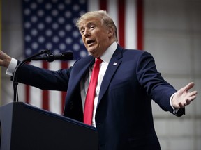 In this March 10, 2018, photo, U.S. President Donald Trump speaks at a campaign rally at Atlantic Aviation in Moon Township, Pa. Weeks after prodding lawmakers to stand up to the National Rifle Association, Trump is backing off his call for increasing the minimum age to buy an assault weapon, an idea strongly opposed by the NRA.