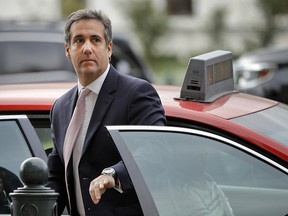 In this Sept. 19, 2017, file photo, Michael Cohen, President Donald Trump's personal attorney, steps out of a cab during his arrival on Capitol Hill in Washington. Cohen's longtime business partner Evgeny Freidman pleaded guilty, Tuesday, May 22, 2018, to tax fraud in a deal that requires him to cooperate in any ongoing investigations.