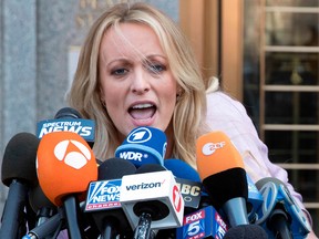 In this April 16, 2018 photo, adult film actress Stormy Daniels speaks to reporters outside federal court in New York.