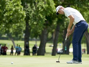 Justin Rose makes a birdie putt on the seventh hole during the final round of the Fort Worth Invitational golf tournament at Colonial Country Club in Fort Worth, Texas, Sunday, May 27, 2018.