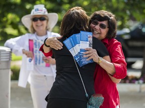 Gubernatorial candidate and former Dallas County Sheriff Lupe Valdez, right greets supporter Samantha Kaylor outside a polling place at Walnut Hill Recreation Center in Dallas on Tuesday, May 22, 2018. The only statewide runoff features little-known Democratic gubernatorial candidates: Ex-Dallas County sheriff Lupe Valdez against Houston businessman Andrew White. Neither is expected to seriously challenge well-funded Abbott.