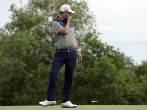 Marc Leishman, of Australia, reacts to his putt on the fourth green during the final round of the AT&T Byron Nelson golf tournament in Dallas, Sunday, May 20, 2018.