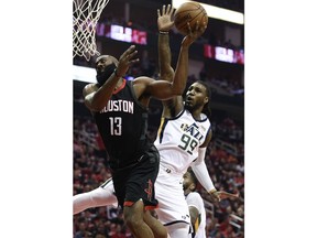 Houston Rockets guard James Harden (13) is fouled by Utah Jazz forward Jae Crowder (99) during the first half in Game 5 of an NBA basketball second-round playoff series, Tuesday, May 8, 2018, in Houston.