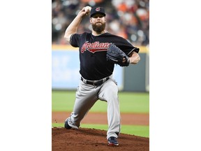 Cleveland Indians starting pitcher Corey Kluber delivers during the first inning of the team's baseball game against the Houston Astros, Saturday, May 19, 2018, in Houston.