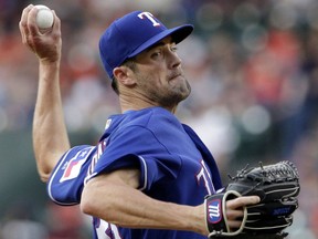 Texas Rangers starting pitcher Cole Hamels throws to a Houston Astros batter during the first inning of a baseball game Friday, May 11, 2018, in Houston.