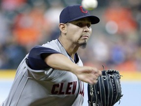 Cleveland Indians starting pitcher Carlos Carrasco (59) throws against the Houston Astros during the first inning of a baseball game Sunday, May 20, 2018, in Houston.