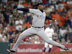 New York Yankees' relief pitcher Aroldis Chapman throws against Houston Astros' Jose Altuve during the ninth inning of a baseball game Thursday, May 3, 2018, in Houston.