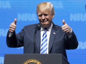President Donald Trump gestures from the podium as as speaks at the National Rifle Association-Institute for Legislative Action Leadership Forum in Dallas, Friday, May 4, 2018.