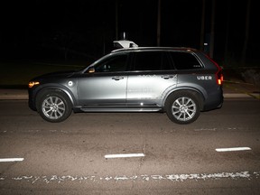 This image provided by the Tempe Police Department shows an Uber SUV after hitting a woman on March 18, 2018 in Tempe, Ariz.  The human backup driver in an autonomous Uber SUV was streaming the television show "The Voice" just before the vehicle struck and killed an Arizona pedestrian in March, according to a published report.