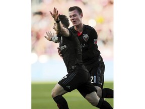 D.C. United forward Paul Arriola (7) and midfielder Chris Durkin (21) celebrate after Arriola's against Real Salt Lake during an MLS soccer match in Sandy, Utah, Saturday, May 12, 2018.