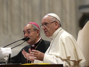 Pope Francis, flanked by Bishop Angelo De Donatis, speaks during a meeting with the Roman diocese, at the Vatican Basilica of St. John Lateran, in Rome, Monday, May 14, 2018.