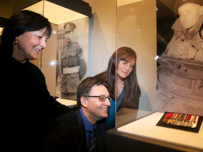 The three grandchildren of Lt. Col. Currie (from left): David, Brenda and Sandy Currie, look on proudly at his medal collection after the unveiling. Three Victoria Crosses were unveiled at the Canadian War Museum, May 1, 2018.