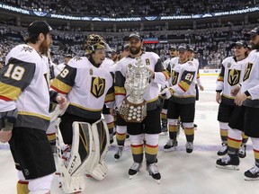 Vegas Golden Knights players celebrate their Western Conference championship with the Clarence S. Campbell Bowl in Winnipeg on May 20.