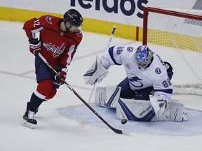 Washington Capitals center Evgeny Kuznetsov (92), from Russia, has his shot blocked by Tampa Bay Lightning goaltender Andrei Vasilevskiy (88), from Russia, during the first period of Game 6 of the NHL Eastern Conference finals hockey playoff series, Monday, May 21, 2018, in Washington.