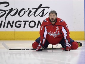 Washington Capitals left wing Alex Ovechkin (8), of Russia, stretches during warm ups before Game 3 of the NHL Eastern Conference finals hockey playoff series against the Tampa Bay Lightning, Tuesday, May 15, 2018 in Washington.