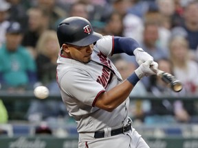 Minnesota Twins' Eduardo Escobar swings and misses to strike out to end of the top of the fourth inning of a baseball game against the Seattle Mariners on Friday, May 25, 2018, in Seattle.