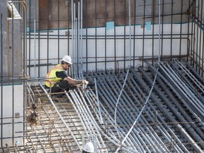 A certified electrician at work on a construction site in Toronto.