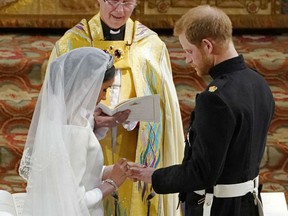 Meghan Markle places a ring on Prince Harry's finger officially sealing him as a married man, simultaneously melting and breaking the hearts of millions watching around the world.