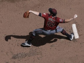 Arizona Diamondbacks starting pitcher Zack Godley throws during the first inning of a baseball game against the Milwaukee Brewers Wednesday, May 23, 2018, in Milwaukee.