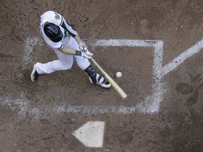 Milwaukee Brewers' Ryan Braun hits an RBI single during the fifth inning of a baseball game against the St. Louis Cardinals Monday, May 28, 2018, in Milwaukee.