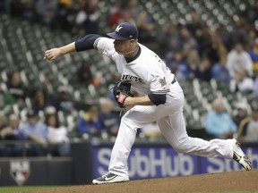 Milwaukee Brewers starting pitcher Chase Anderson throws during the first inning of a baseball game against the Arizona Diamondbacks Monday, May 21, 2018, in Milwaukee.